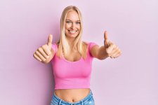 stock-photo-young-blonde-girl-wearing-casual-clothes-approving-doing-positive-gesture.jpg